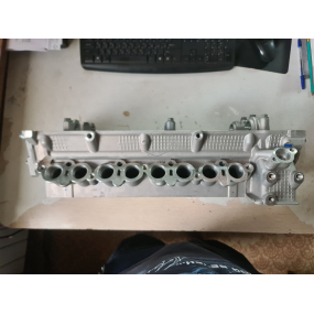 Головка блока ЗМЗ-409051-00 (3-ёх опорная с клапанами, прокладкой и крепежом